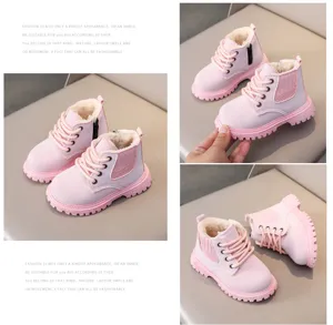 Kids pink plush lined martin boots detailed view, winter footwear with side zipper.