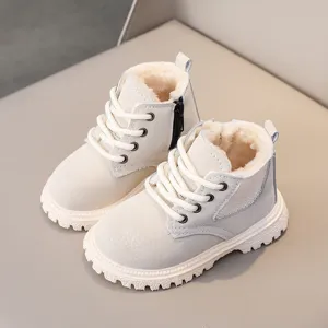 Detail view of cozy children winter martin boots with plush lining, side zipper and soft sole.