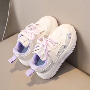 Kids casual sneakers detail shot, soft sole retro runner shoes with cute whale prints.