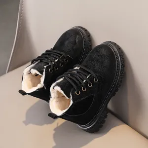 Kids winter martin boots detail, black plush lined toddler snow boots, warm lace-up design.