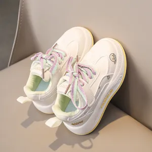 Detailed view of kids casual sneakers showing soft sole, colorful laces and side accent.