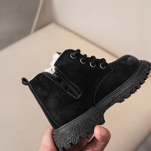 Close-up detail of children winter martin boots featuring plush fleece lining and sole.