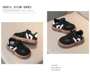 Kids black white sneakers detail view, breathable casual sport shoes with velcro strap.