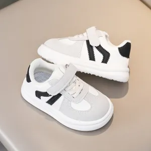 Kids casual sneakers with hook and loop closure, white and black color block detail, comfy grip sole.