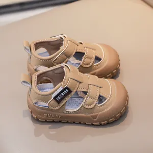 Detailed close-up of breathable toddler summer sandals in khaki with comfortable velcro strap.
