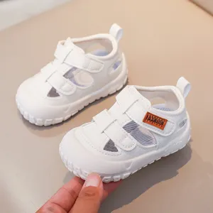 Toddler summer white hollow sandals with velcro, comfortable soft bottom baby beach shoes.