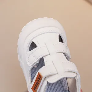 White toddler sandals for summer, breathable hollow design with soft soles for baby boys and girls.
