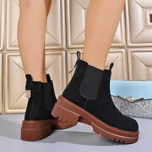 Chic black suede Chelsea boots for women with comfortable chunky lug platforms and stylish heels.