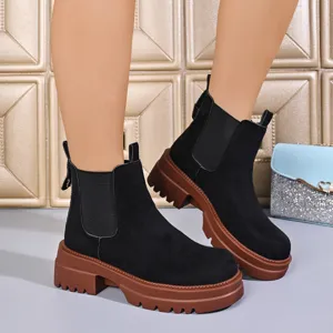 Black suede Chelsea boots for women featuring thick brown platform soles and round toe.