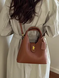 Stylish retro women's bucket bag PU leather top handle shoulder crossbody bag for daily wear.
