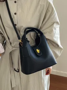 Classic black bucket bag for women, stylish leather crossbody handbag with shoulder strap.