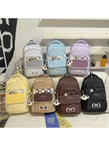 Bunter Schulrucksack mit grosser Kapazitaet und niedlichem Hundesphaenger fuer taeglichen Gebrauch.