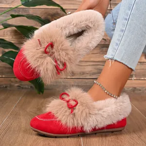 Detailed view of women winter plush warm flat shoes with cute bow design and cozy lining.