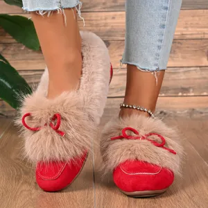 Cozy red plush slip-on shoes with soft faux fur lining and cute bow detail for winter warmth.