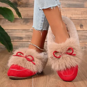 Detailed view of women's warm plush casual shoes in red with cozy fur trim and cute bow.