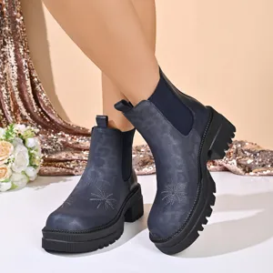 Chunky platform chelsea boots with delicate floral embroidery detail and elastic side panel.