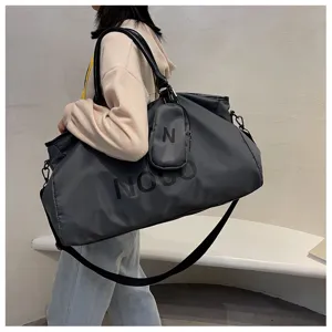 Large capacity travel duffel bag for fitness, sports and business trips with shoulder strap.
