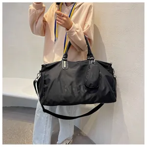 Large capacity travel duffel bag for women men gym sports overnight weekend trips.