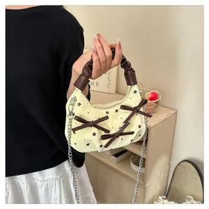 Detailed view of the Korean style star print handbag with gathered handle and chain strap.