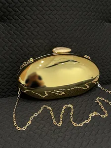 Gold acrylic evening clutch bag with metal chain strap elegant women's crossbody shoulder bag.