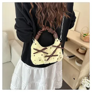Korean style chic shoulder crossbody bag with star print, cute bows and chain strap details.