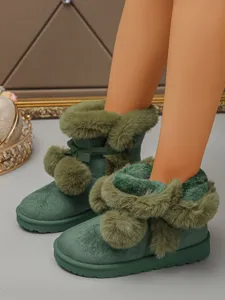 Women's green short snow boots with plush lining, cute bow and pom-pom decor, thick sole.
