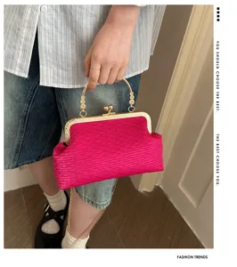Pink pleated evening bag with gold metal frame lock, elegant chain crossbody bag for women.