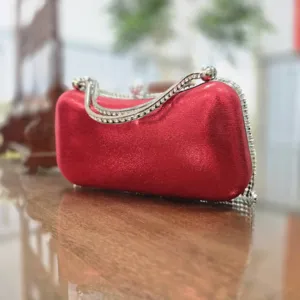 Red rhinestone evening clutch bag with sparkling crystal handles and elegant tassel details for parties.