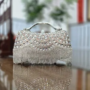 Exquisite rhinestone evening bag detail, sparkling crystals and delicate hanging fringe design.