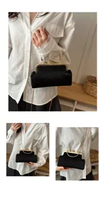 Detailed view of the black pleated kiss-lock evening bag with chic gold chain strap for women.