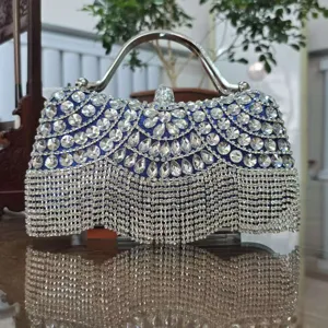 Glittering crystal evening clutch bag with sparkling rhinestones, elegant silver metal handle.