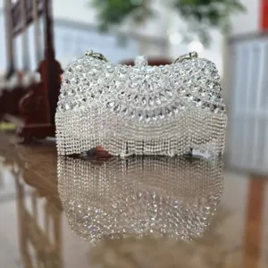 Luxury rhinestone clutch bag with sparkling crystals and fringe tassel for women evening party.