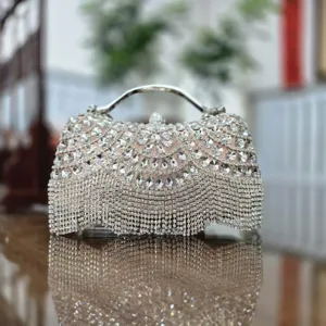 Sparkling rhinestone evening clutch bag with fringe and metal handle for women banquets.
