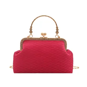 Elegant pink pleated evening bag with gold kiss-lock metal handle and chain strap for women.