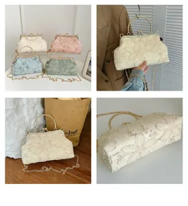 Elegant floral embroidered evening bag with gold chain strap and metal handle for women detail view.