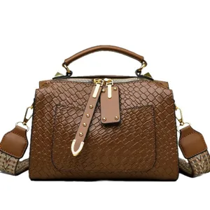 Vintage brown woven PU leather shoulder bag with top handle and stylish front pocket design.