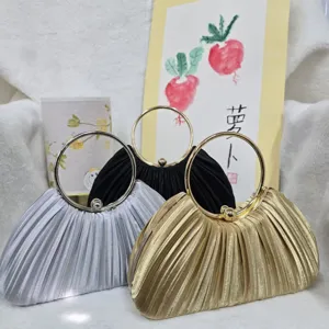 Elegant pleated evening bag with metal round handle for party and banquet events.
