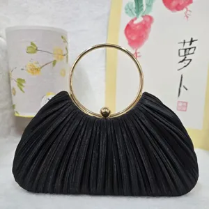 Black pleated evening clutch bag with gold round metal ring handle for party wedding events.