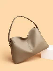 Stylish minimalist leather shoulder bag for women, large capacity daily tote handbag.