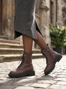 Damen Vintage Martin Boots mit klobiger Sohle, Litschileder, Schnürung und seitlichem Reißverschluss.