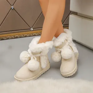 Women's short snow boots with plush faux fur trim, sweet bow and fluffy pom-pom decor.