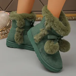 Green winter snow boots for women with plush lining, cute bow and pom-pom decor, thick soles.