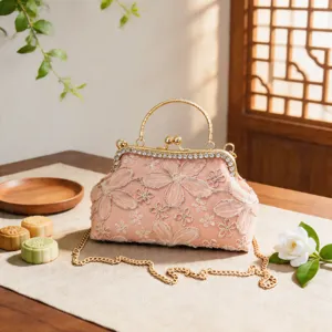 Elegant Chinese style evening bag with floral embroidery, rhinestones, gold chain.
