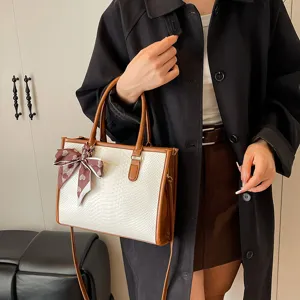 Stylish minimalist contrast color tote bag for women, versatile PU leather shoulder bag.