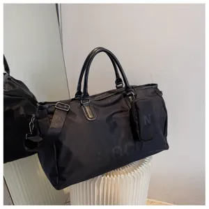 Black travel duffel bag large capacity sports gym bag with shoulder strap and pouch.