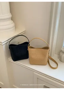 Woven leather bucket bag detail, casual soft shoulder crossbody bag in classic chic design.