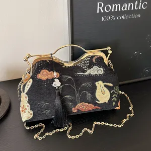 Vintage Chinese style embroidered kiss-lock handbag with gold chain strap, elegant evening crossbody bag.