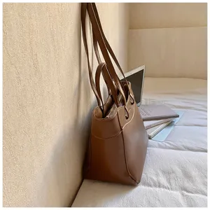 Brown PU leather tote bag detail view, casual large capacity shoulder bag for women.