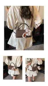 Korean retro solid color shoulder crossbody bag for women, brown matte PU leather handbag with cute plush pendant.