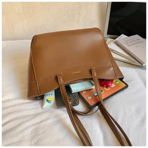 Brown PU leather tote bag for women, large capacity shoulder bag with practical storage space.